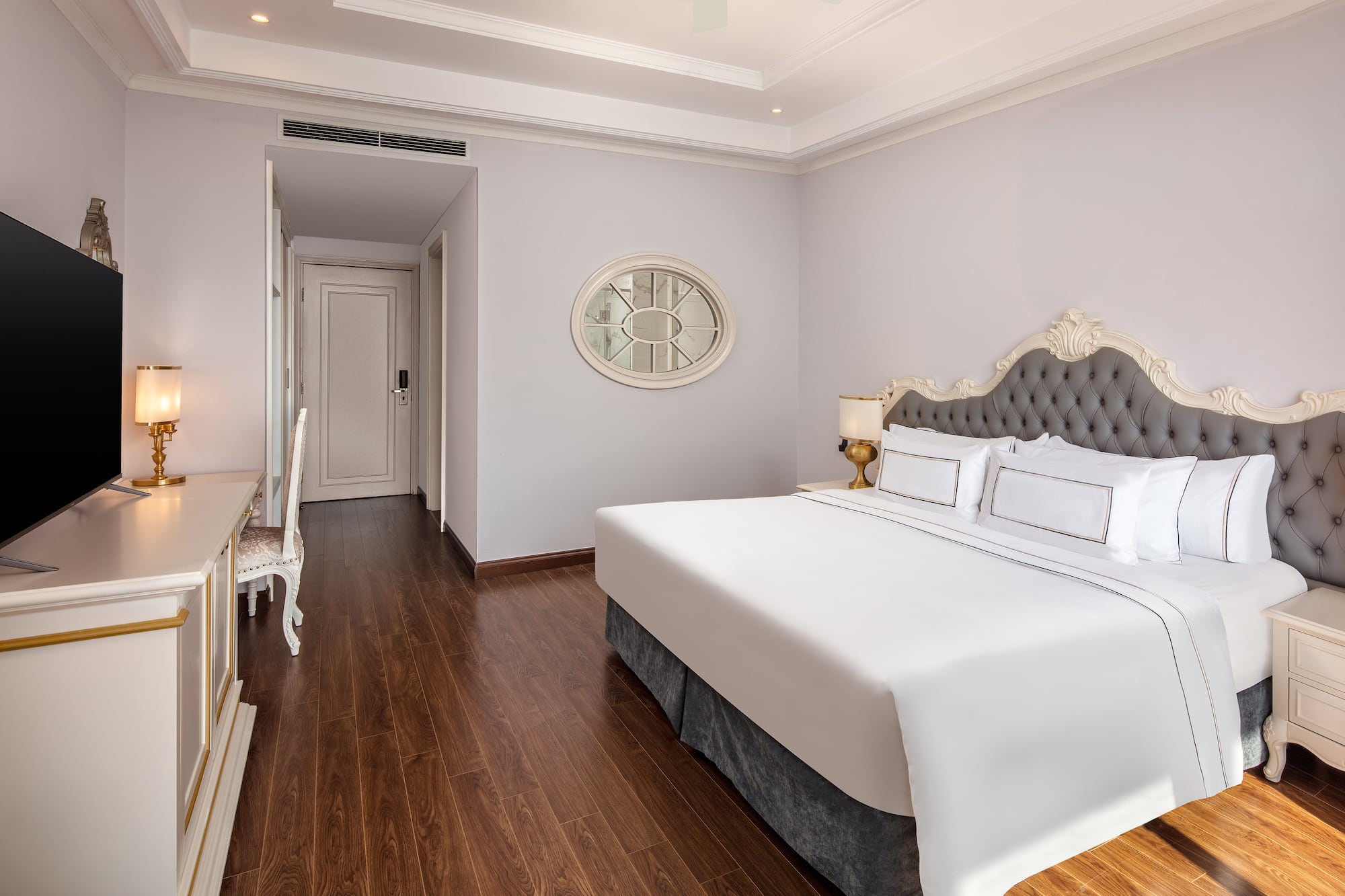 a bedroom with a bed and a desk