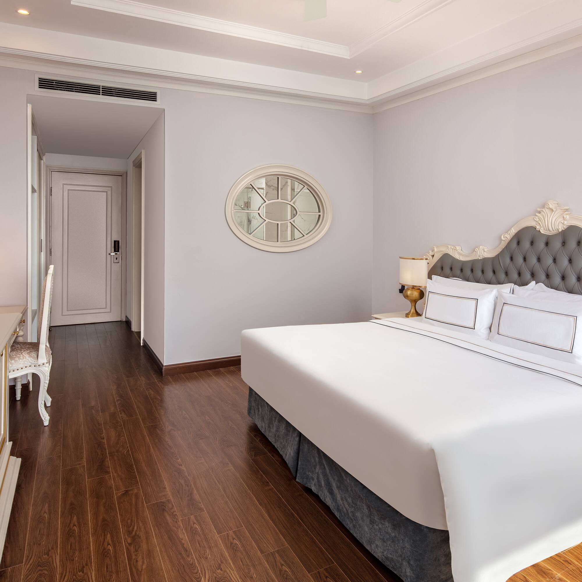 a bedroom with a bed and a desk