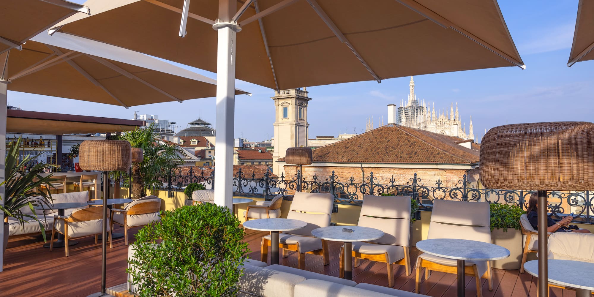 a patio with chairs and umbrellas
