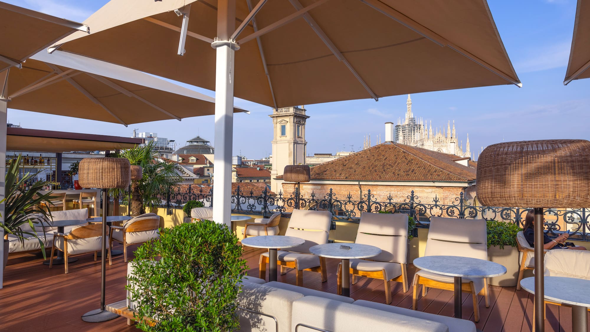 a patio with chairs and umbrellas