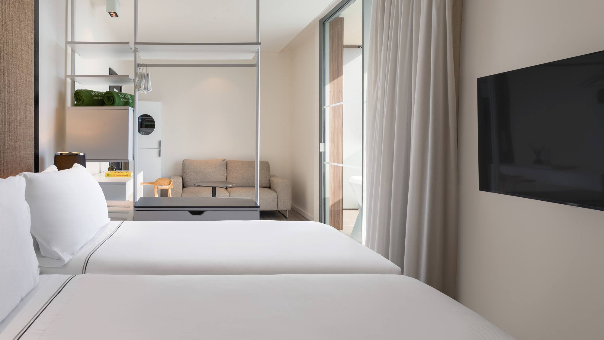 a room with a tv and a bed