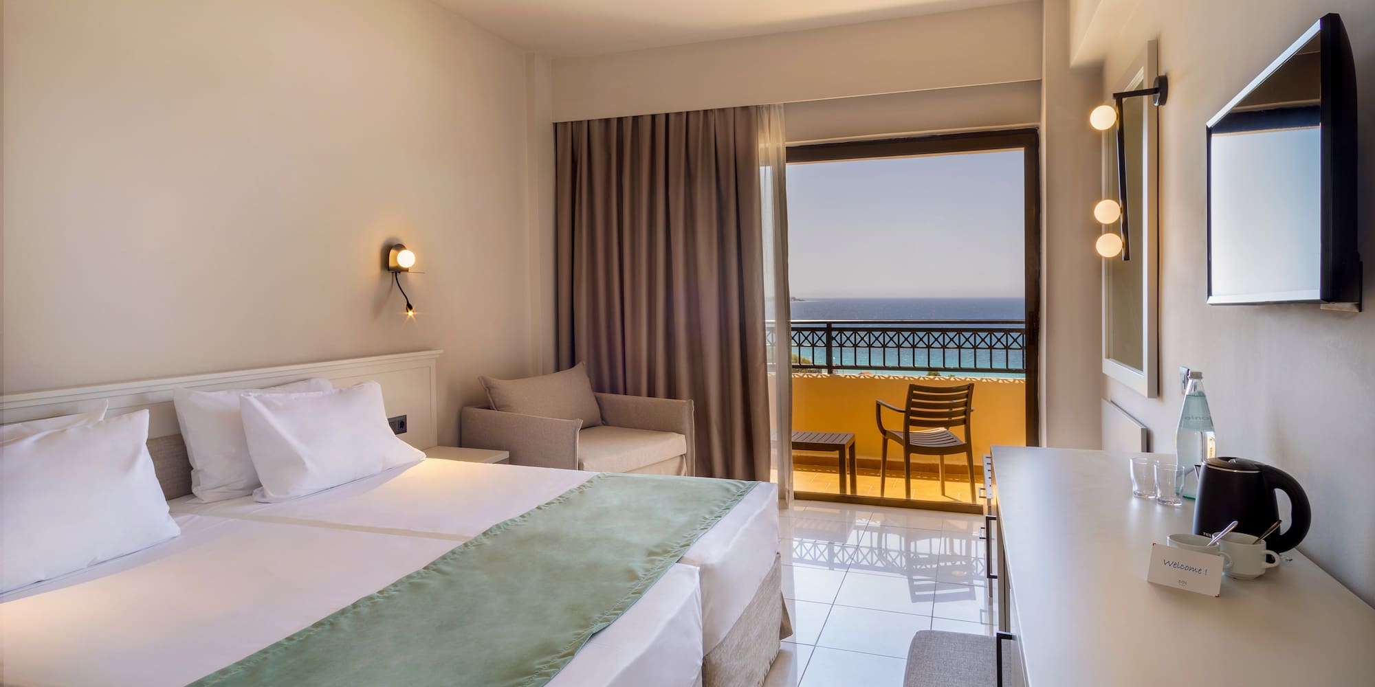 a room with a bed and a table and chairs