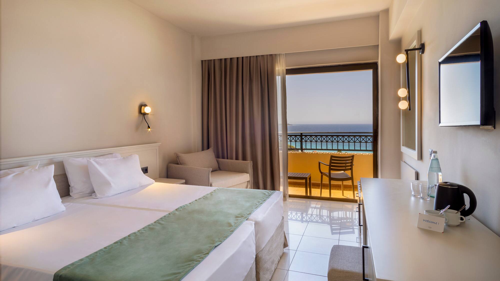 a room with a bed and a table and chairs