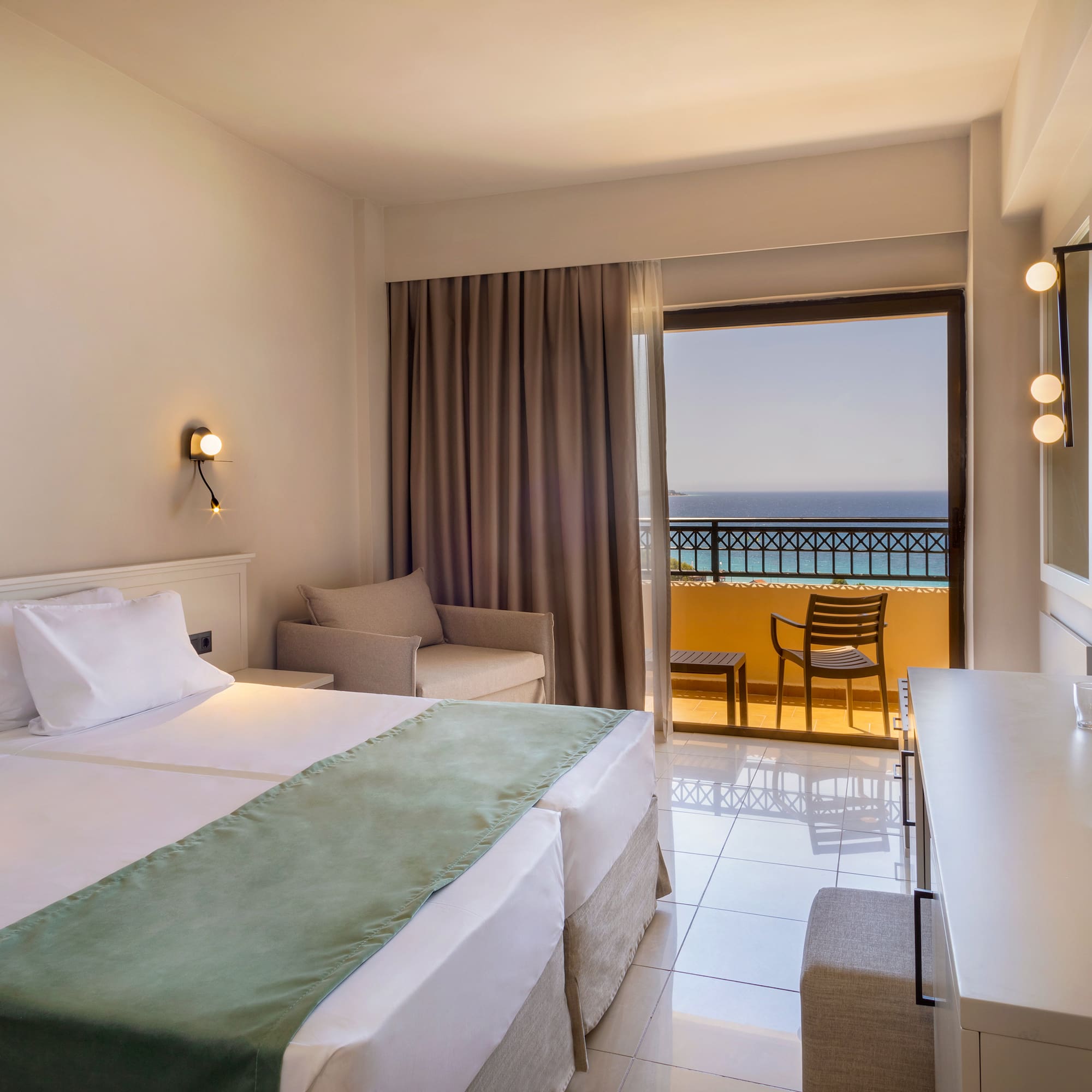 a room with a bed and a table and chairs