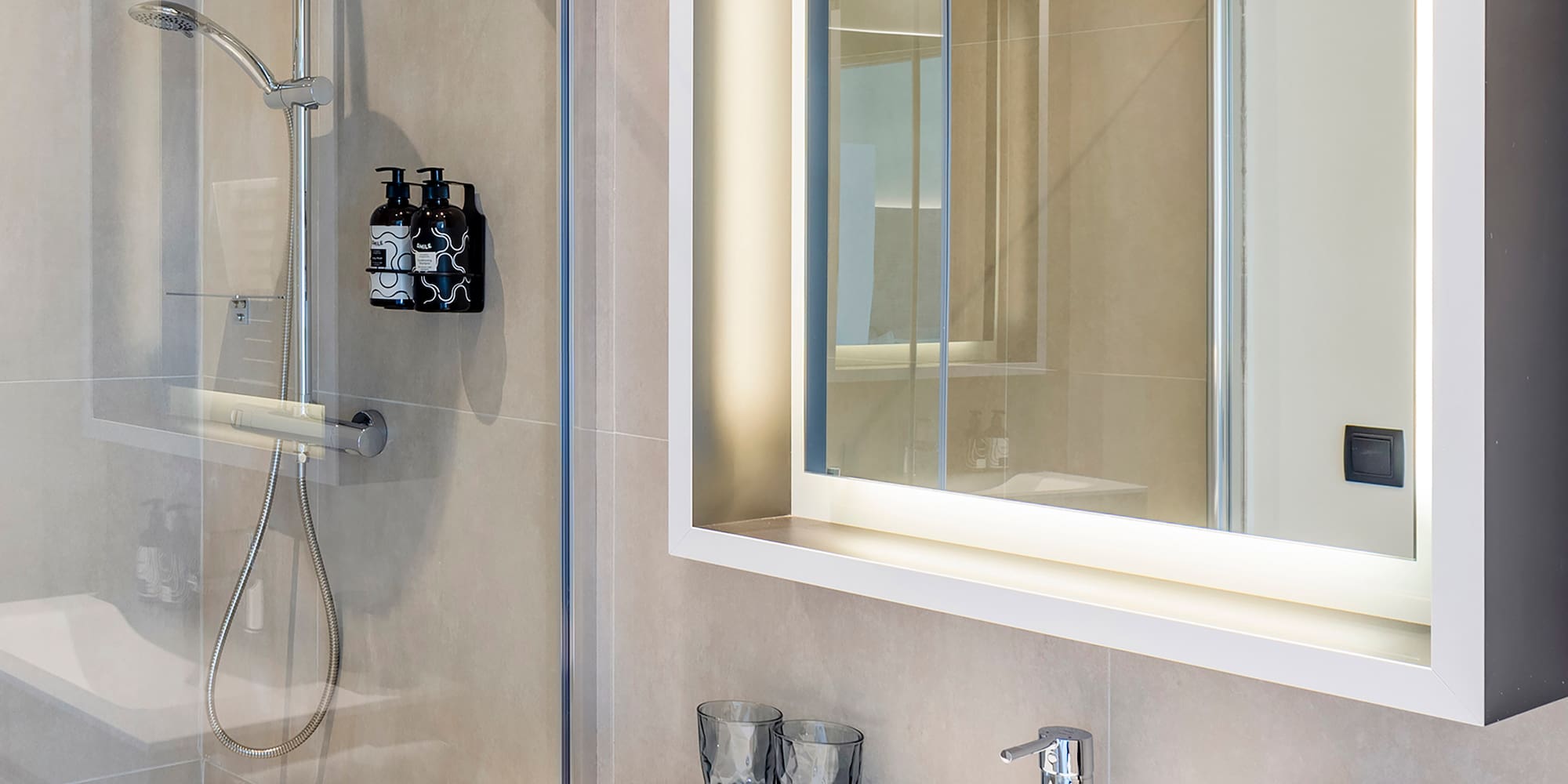 a bathroom with a mirror and sink