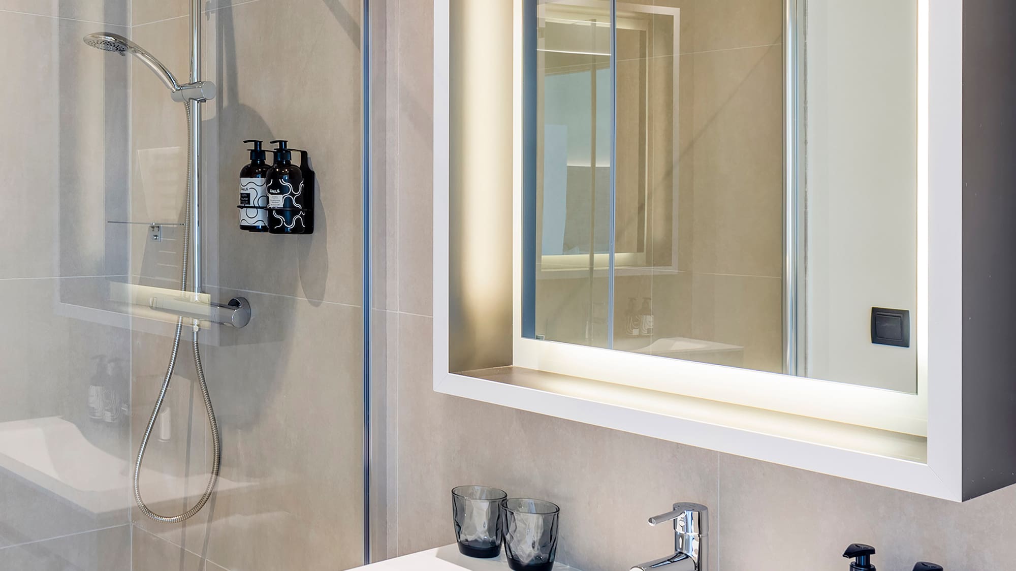 a bathroom with a mirror and sink