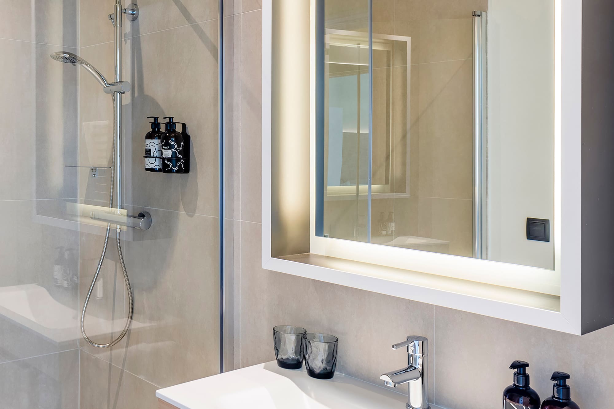 a bathroom with a mirror and sink