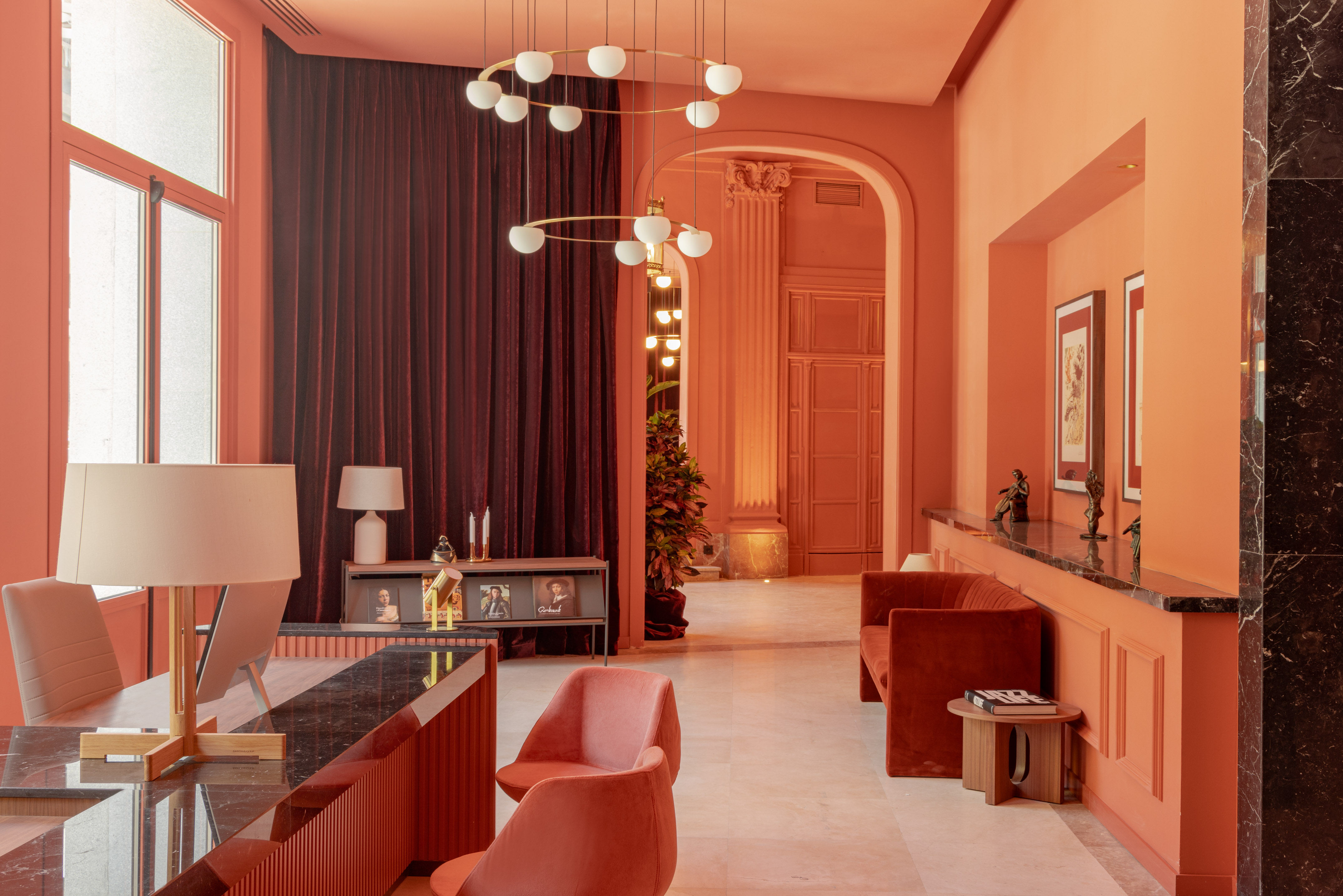 a living room with a chandelier and a table