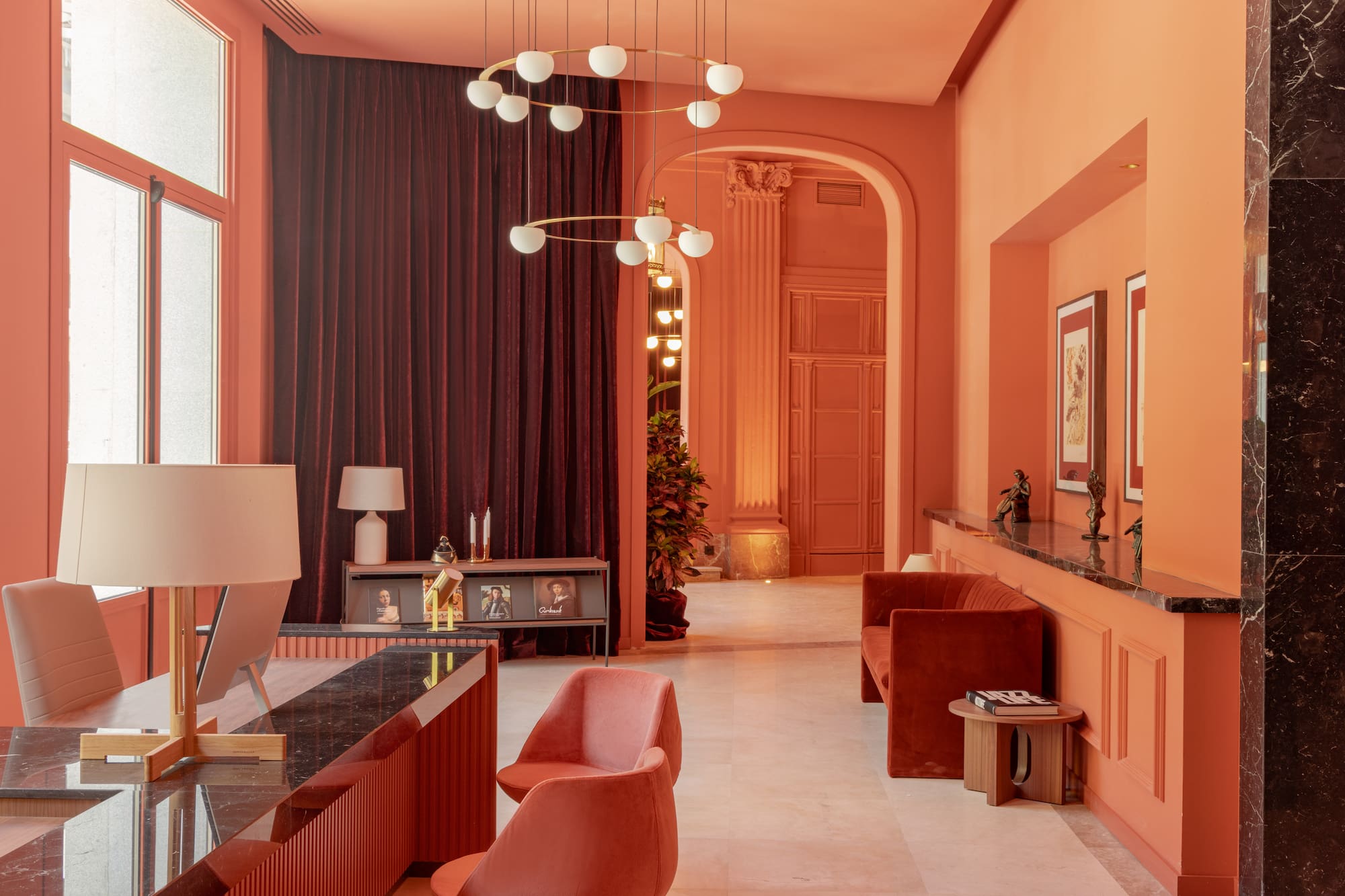 a living room with a chandelier and a table