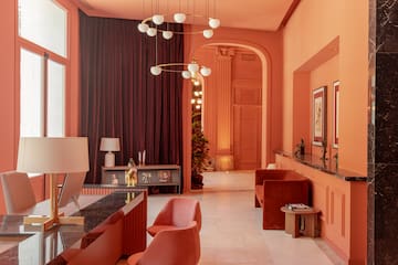 a living room with a chandelier and a table