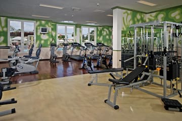 a large room with exercise equipment