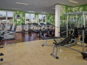 a large room with exercise equipment