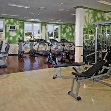 a large room with exercise equipment