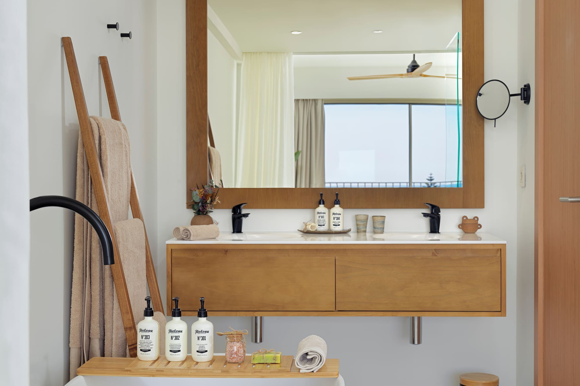 a bathroom with a bathtub and a mirror