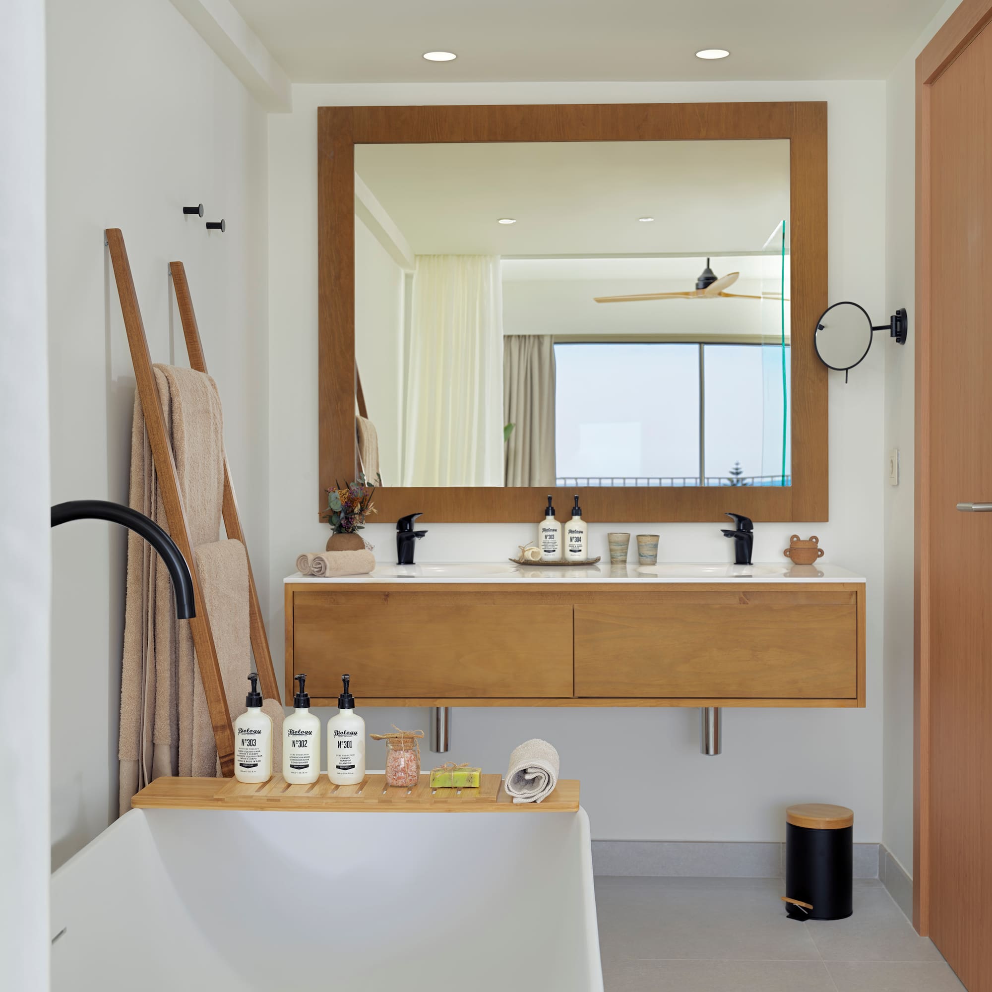 a bathroom with a bathtub and a mirror