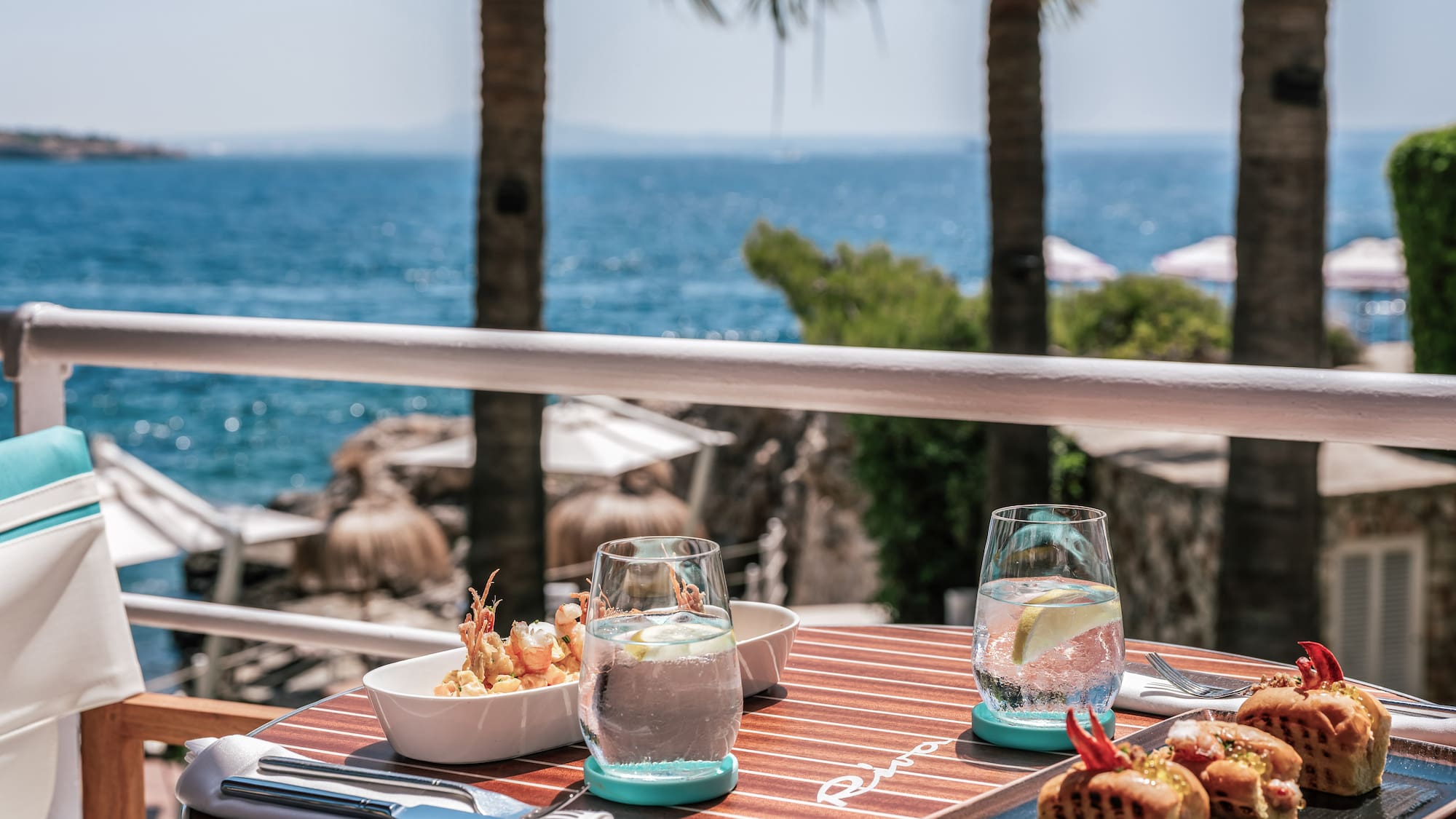 a table with food on it and a glass of water on it