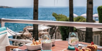 a table with food on it and a glass of water on it