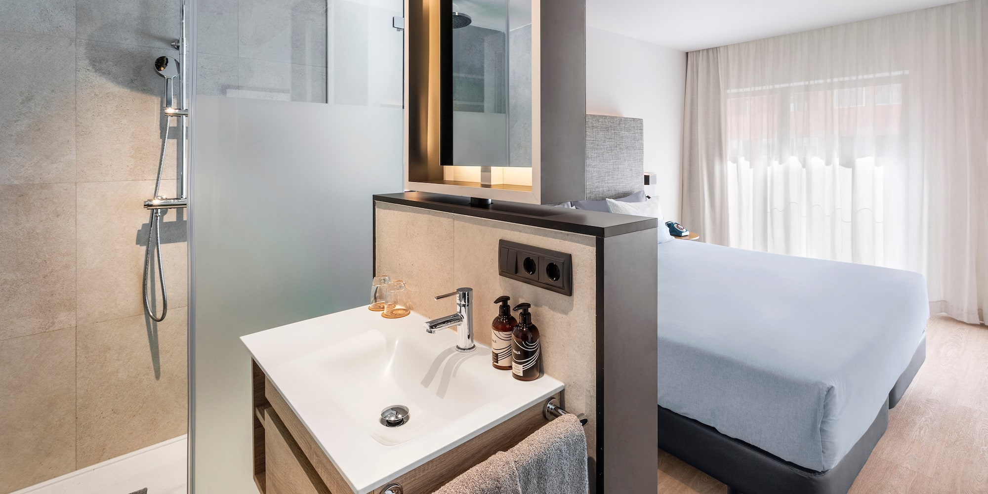 a bathroom with a shower and a mirror