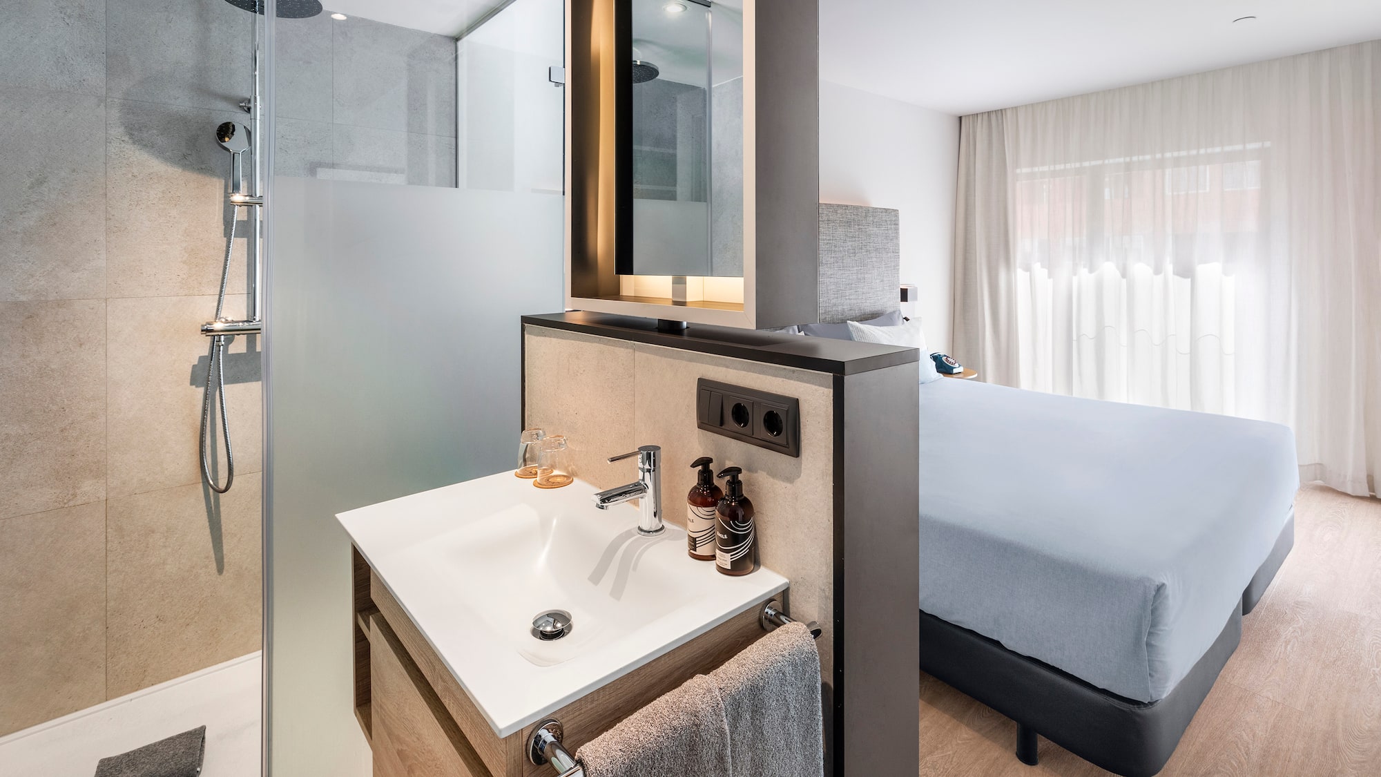 a bathroom with a shower and a mirror