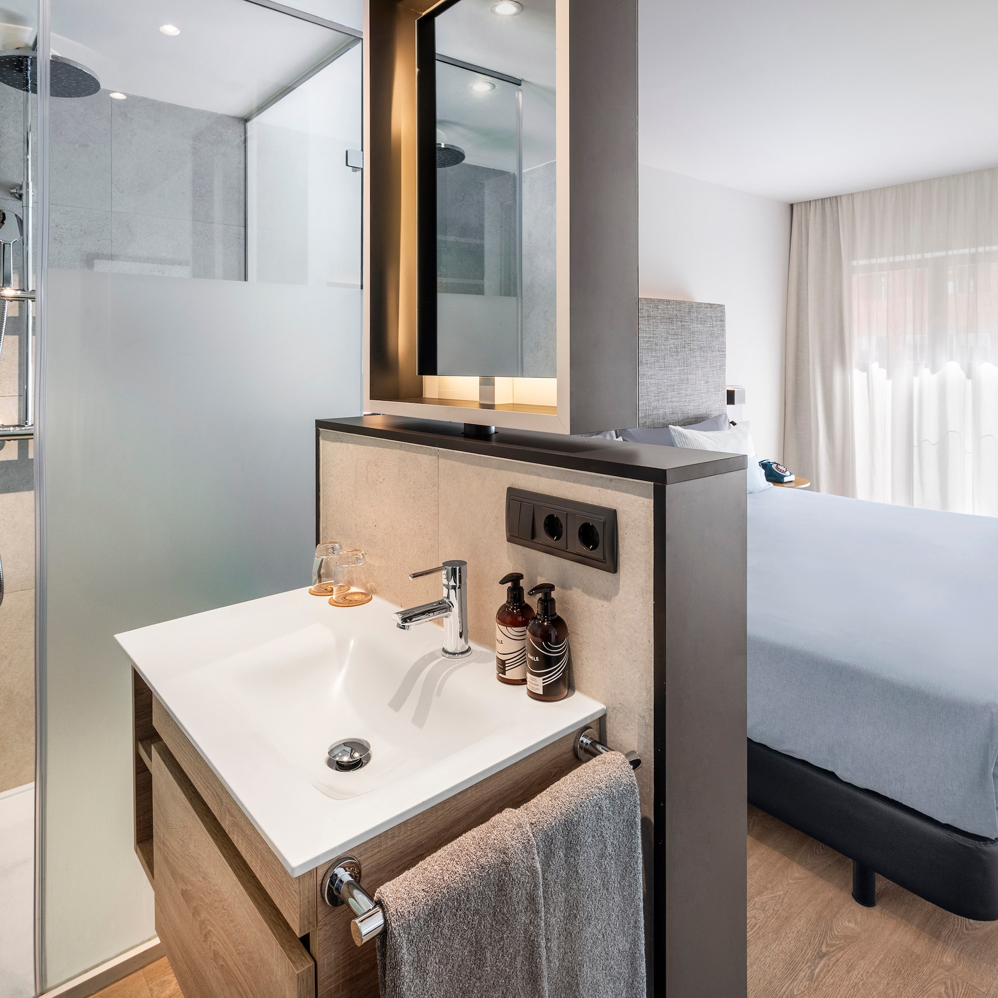 a bathroom with a shower and a mirror