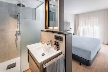 a bathroom with a shower and a mirror