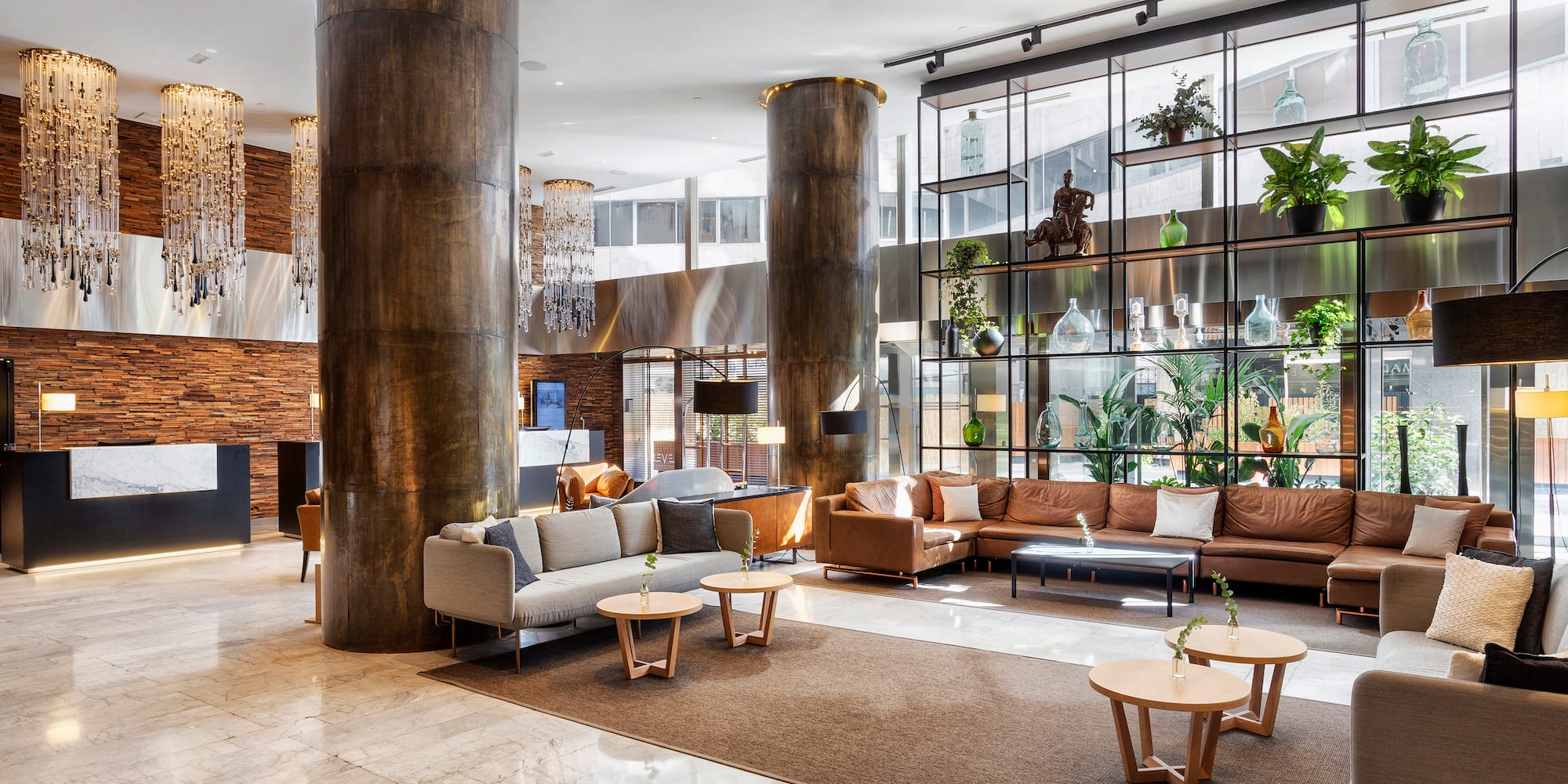 a large room with a large column and a large couch