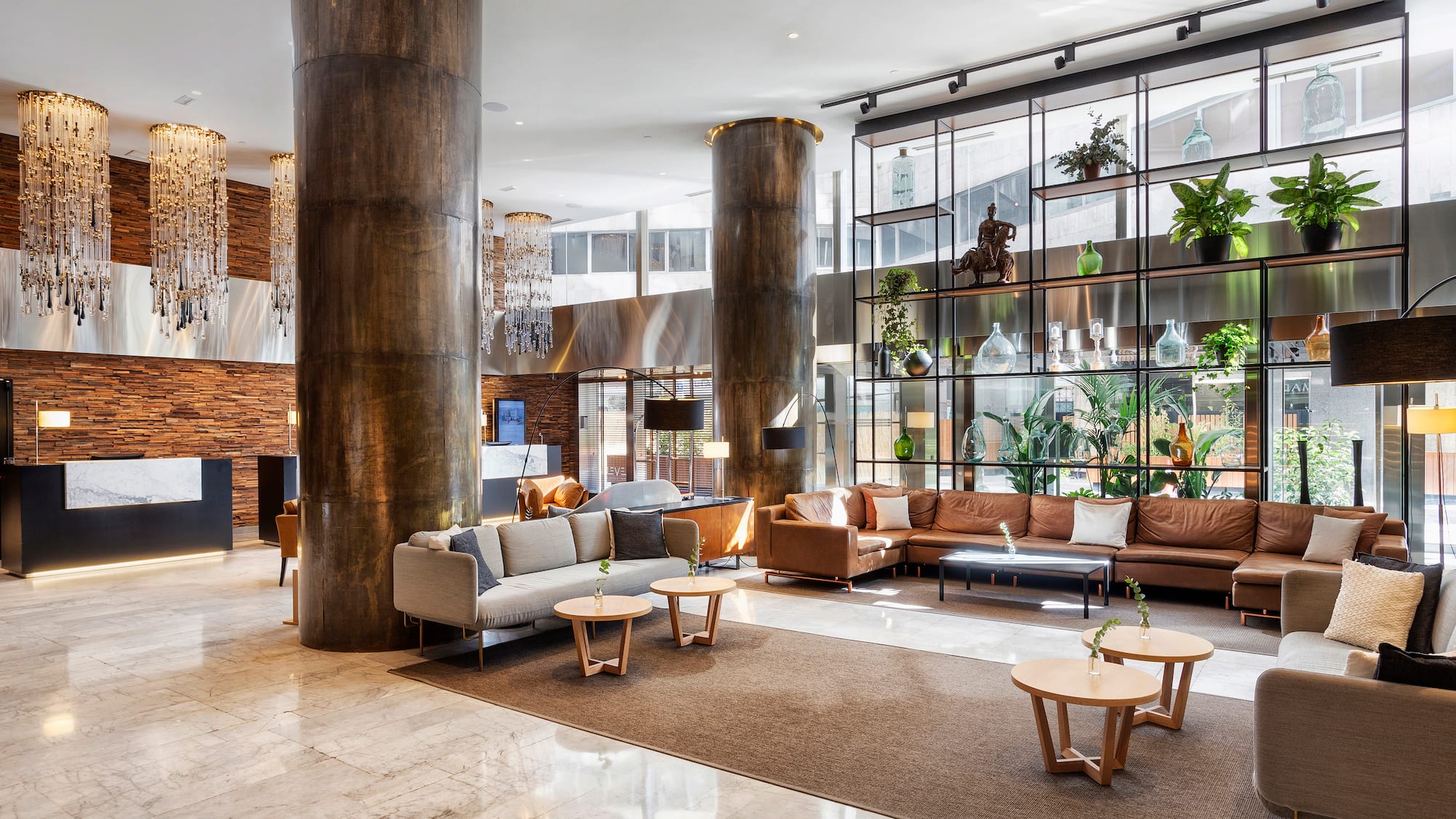 a large room with a large column and a large couch