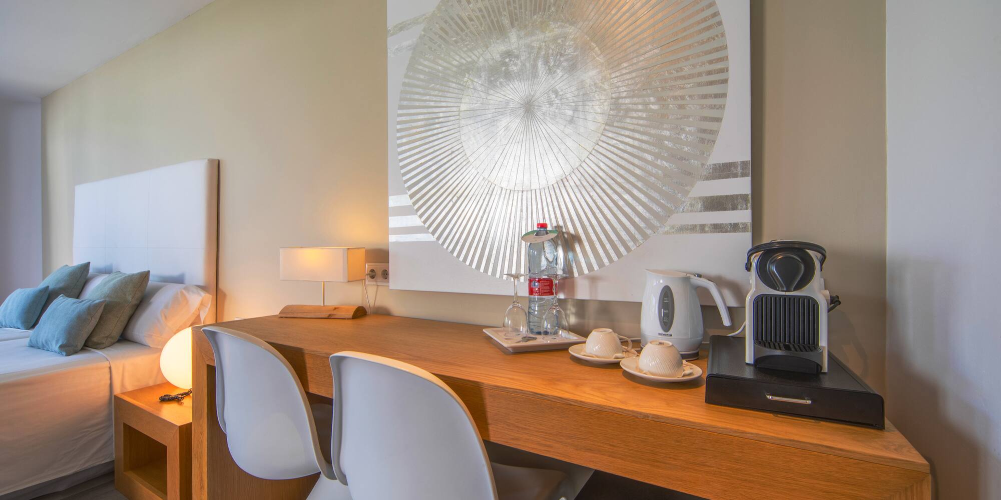 a table with chairs and a coffee maker