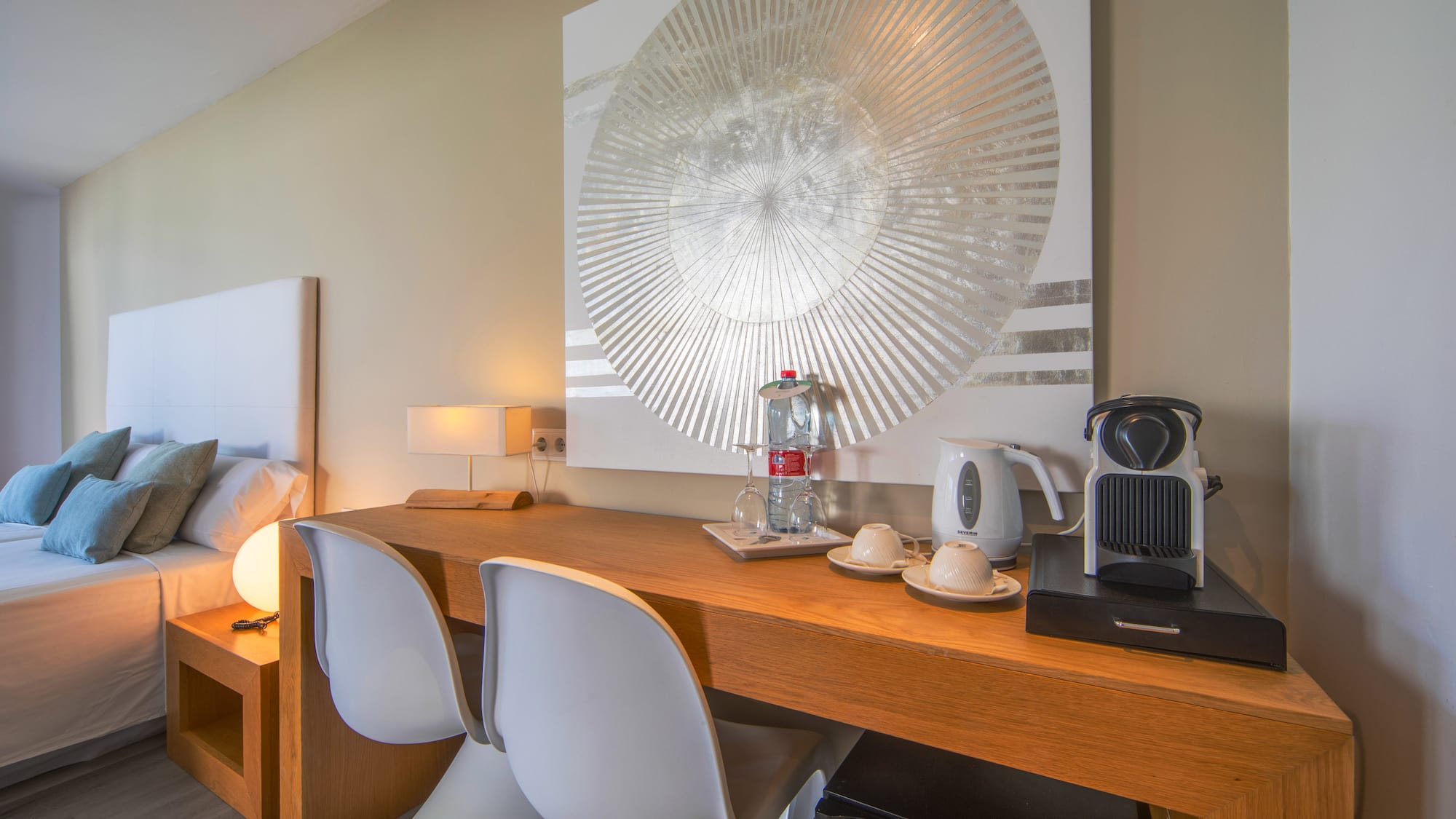 a table with chairs and a coffee maker