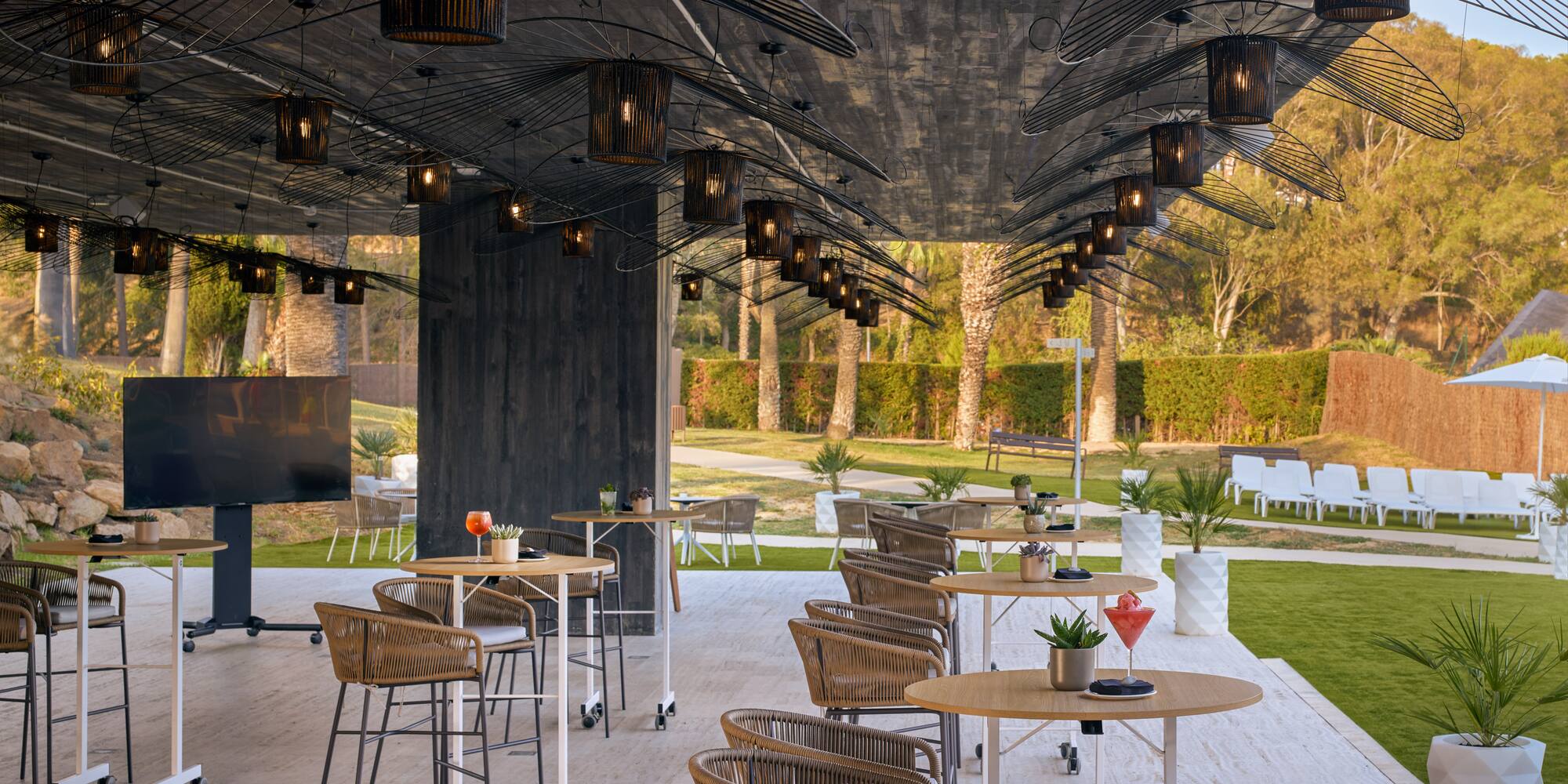 a patio with tables and chairs