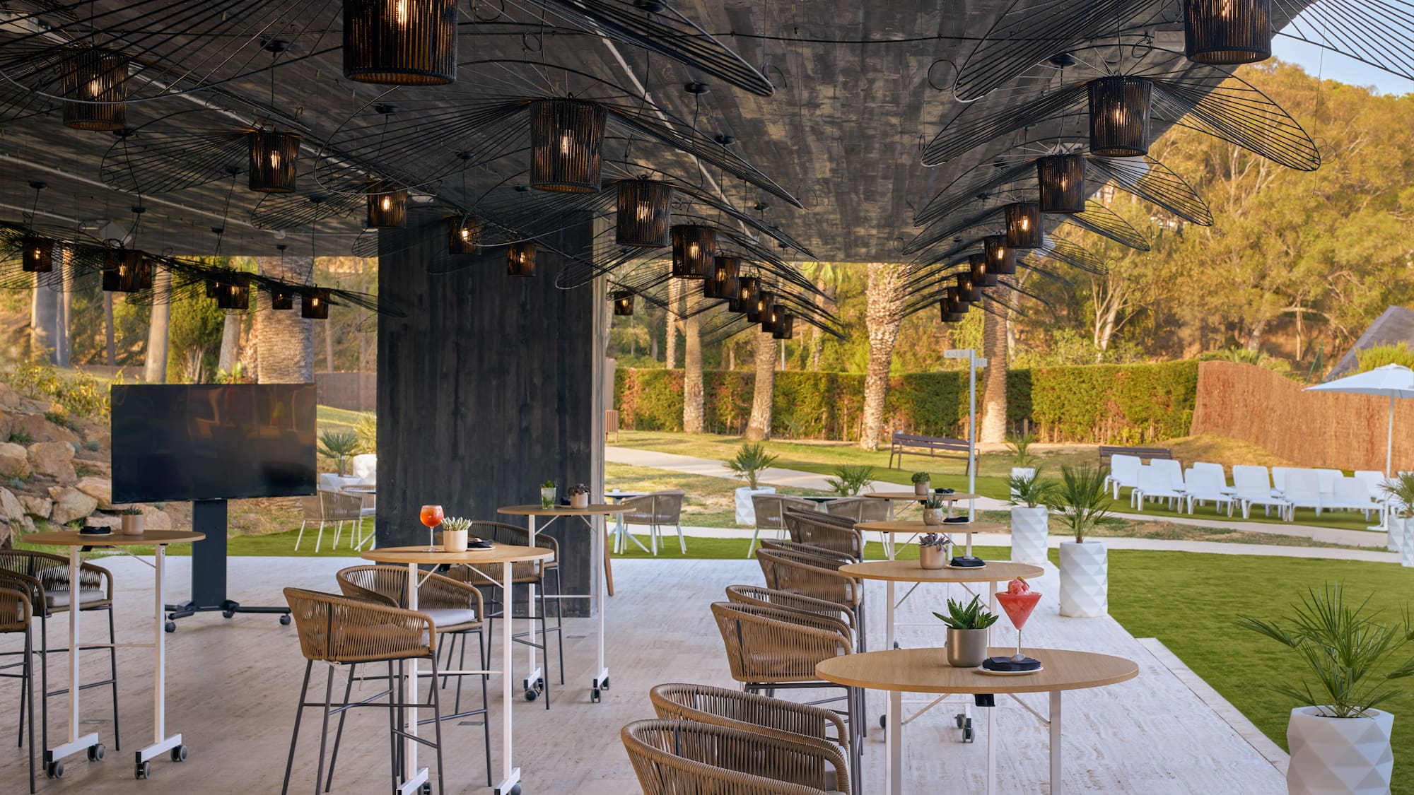 a patio with tables and chairs