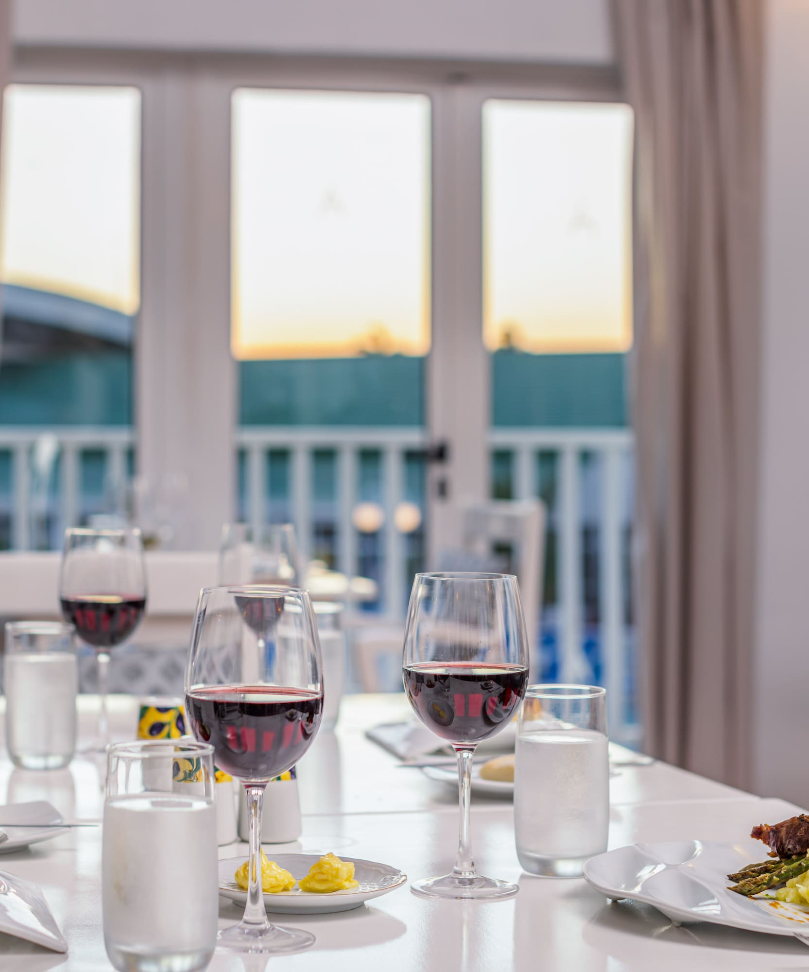 a table with food and wine glasses on it