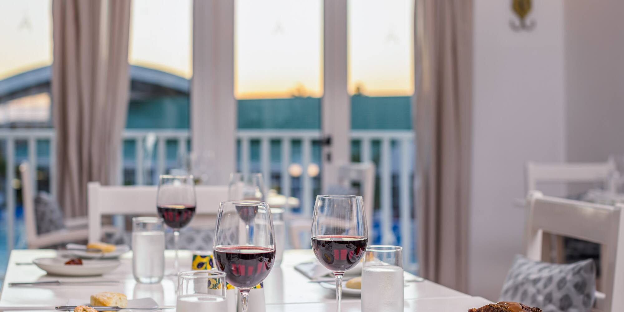 a table with food and wine glasses on it