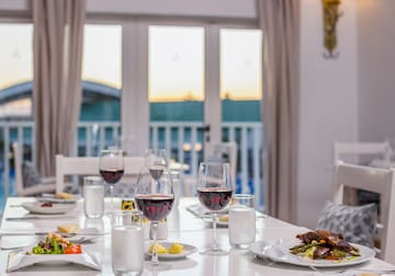 a table with food and wine glasses on it