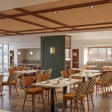 a room with tables and chairs