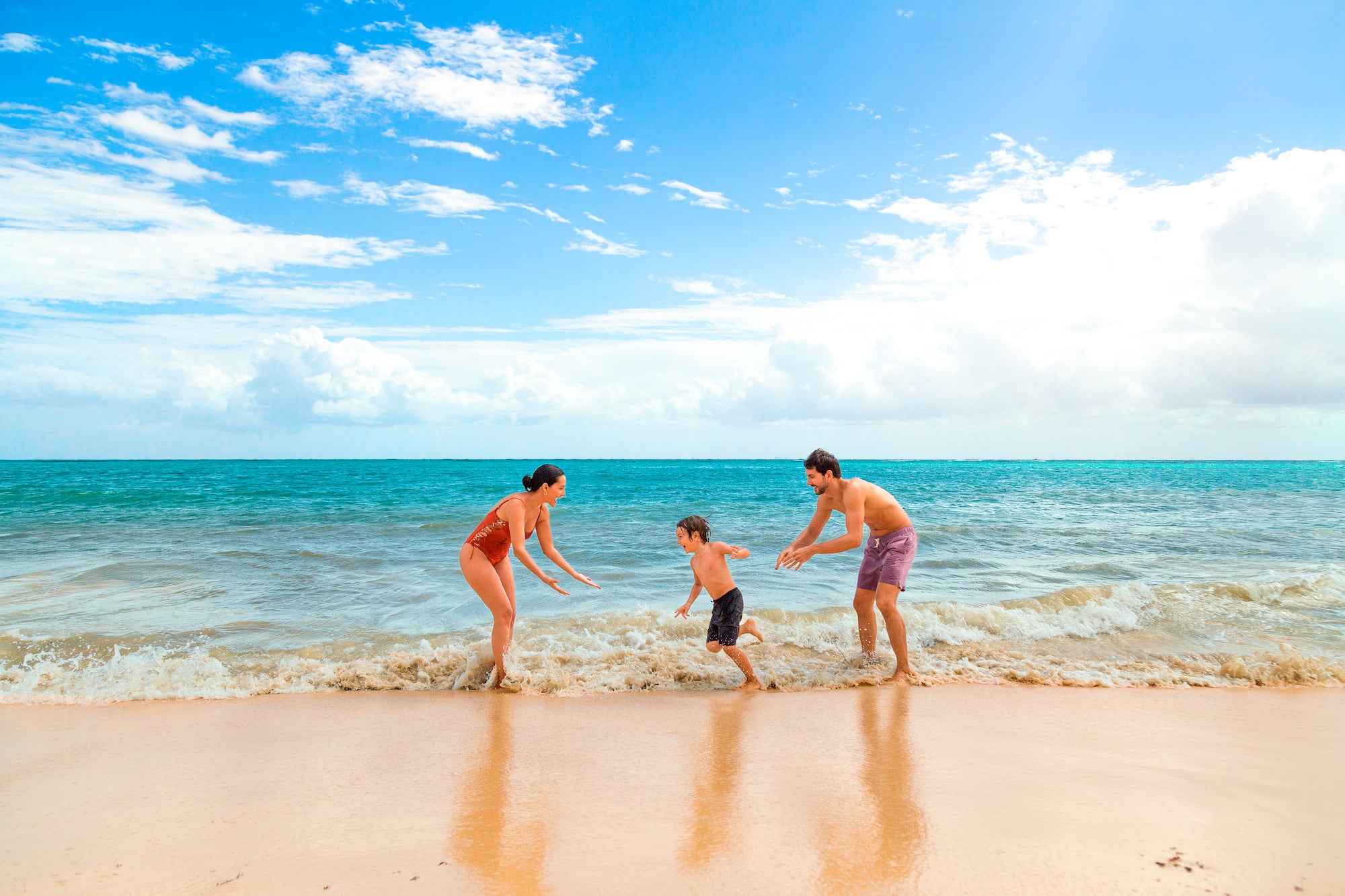 a group of people playing in the water