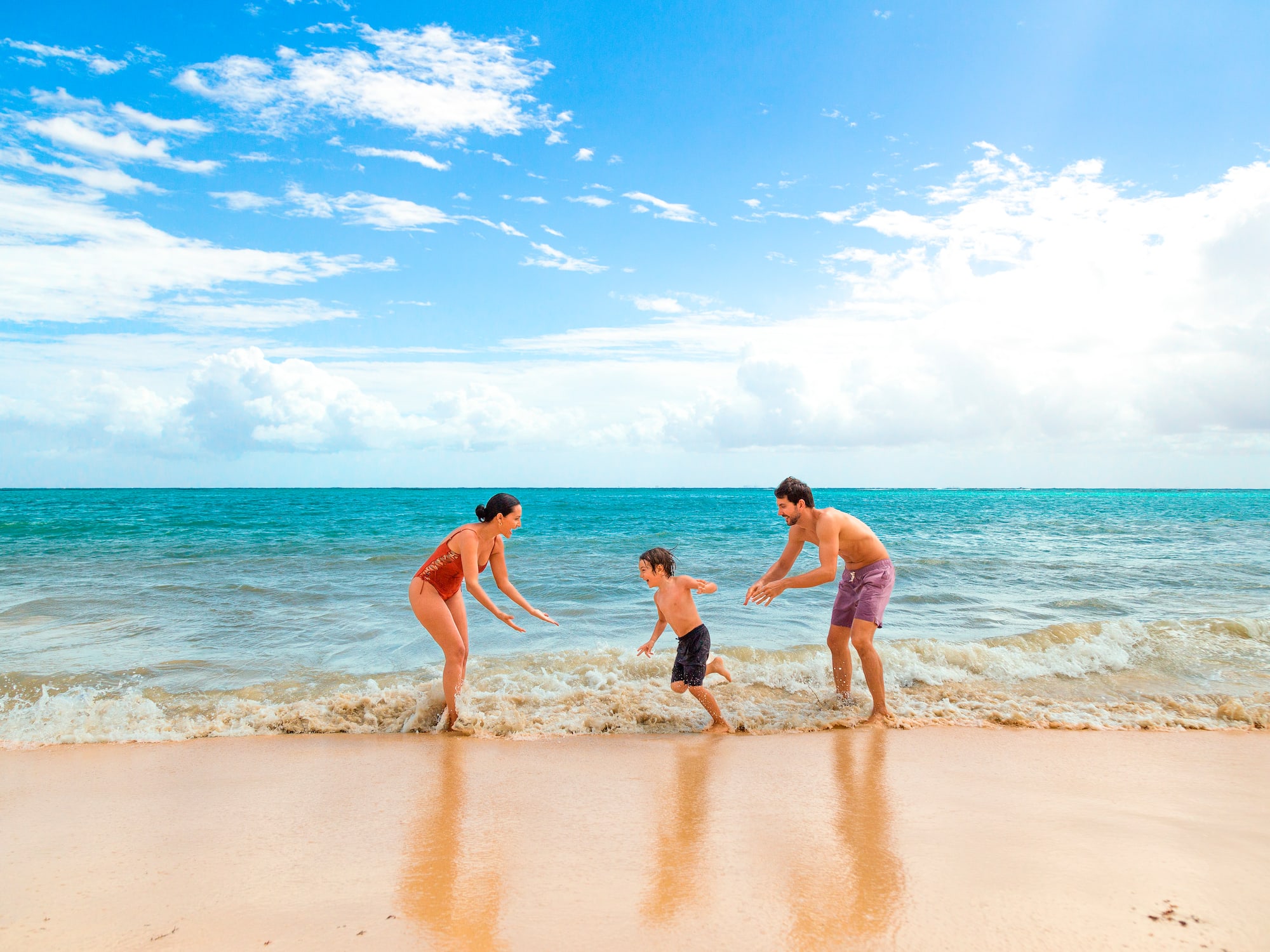a group of people playing in the water