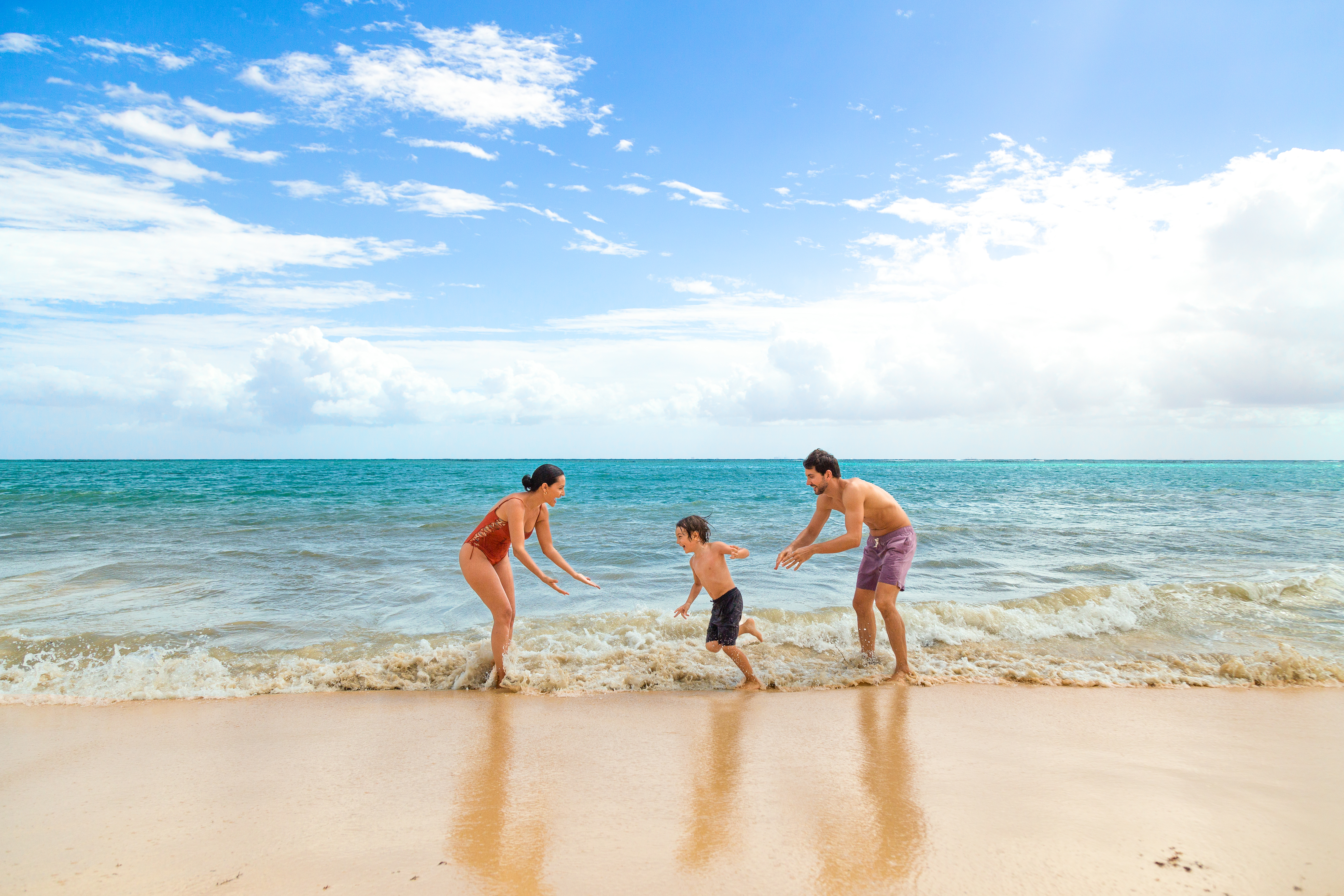 a group of people playing in the water