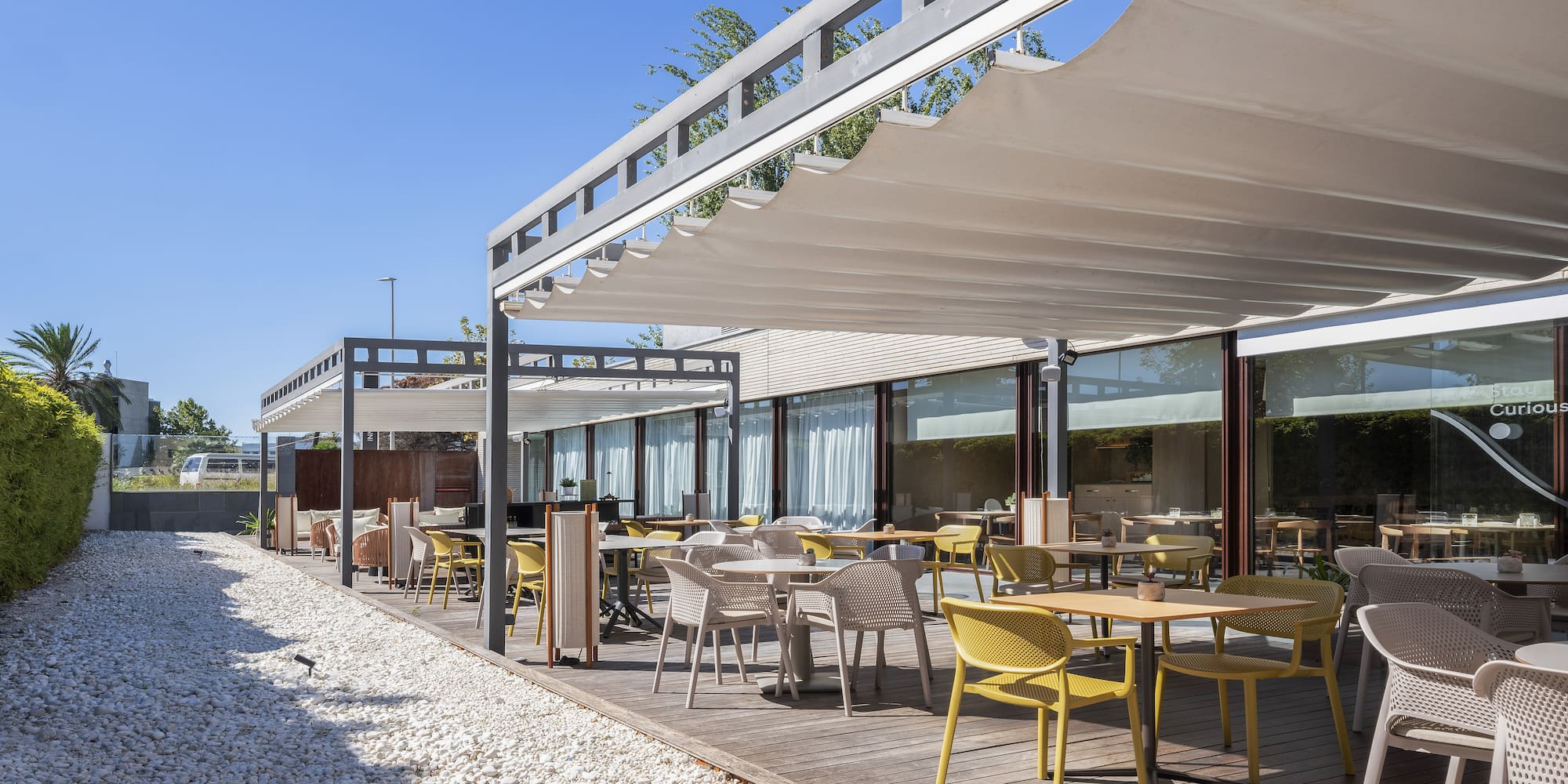 a patio with tables and chairs