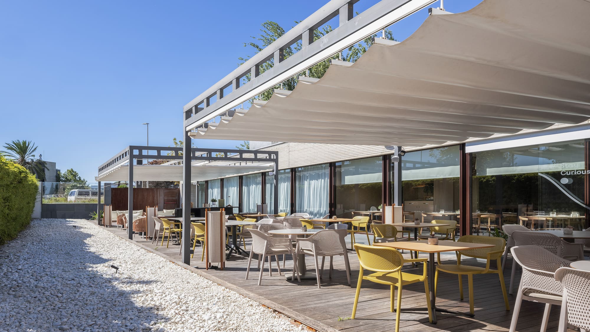 a patio with tables and chairs