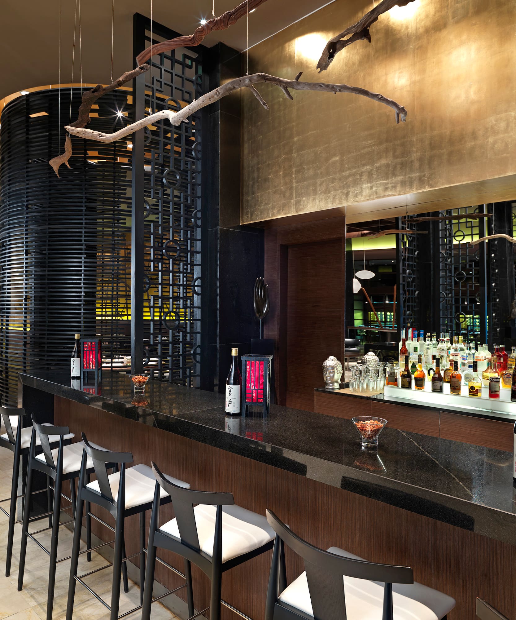 a bar with bottles and stools