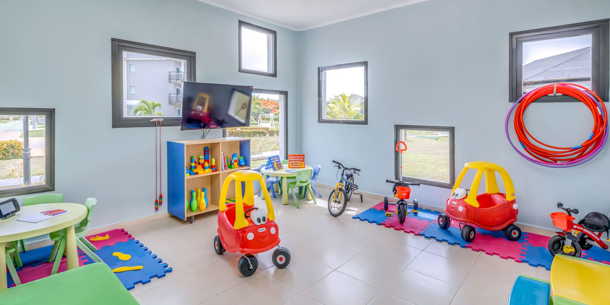 a room with toys and a tv