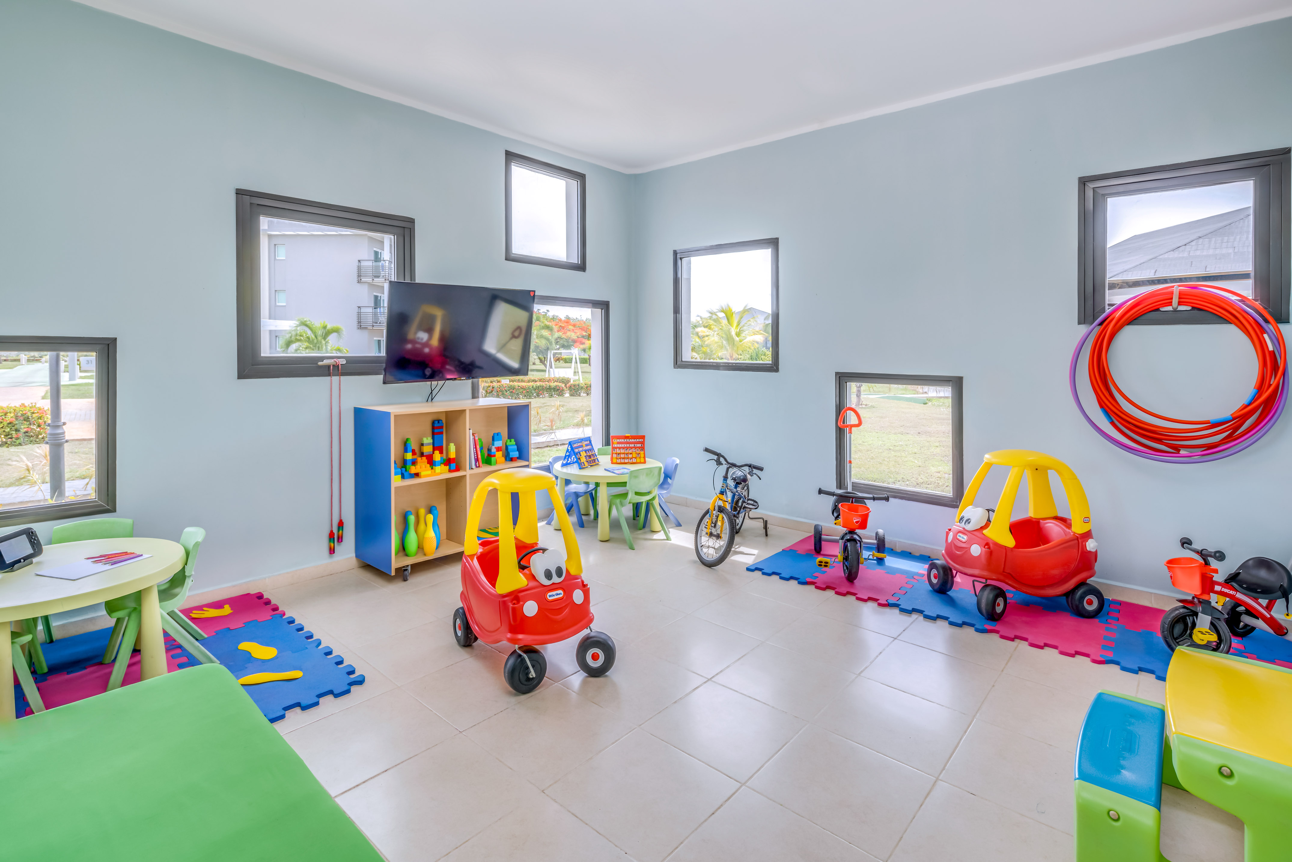 a room with toys and a tv