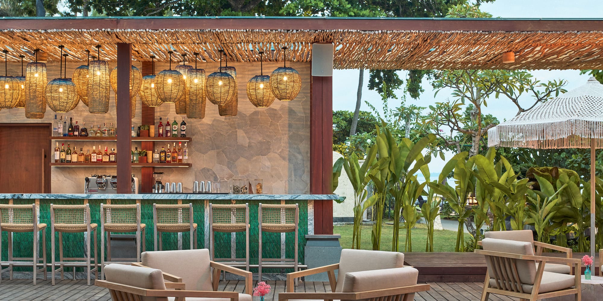 a patio with chairs and a bar