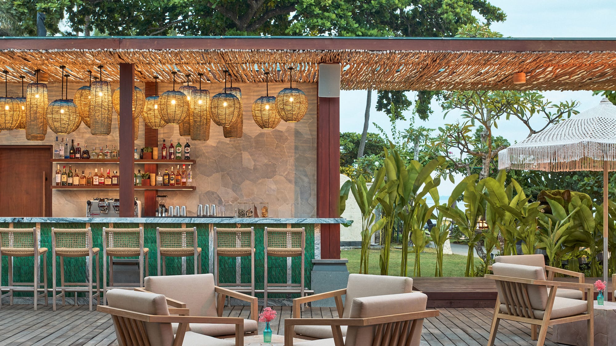 a patio with chairs and a bar