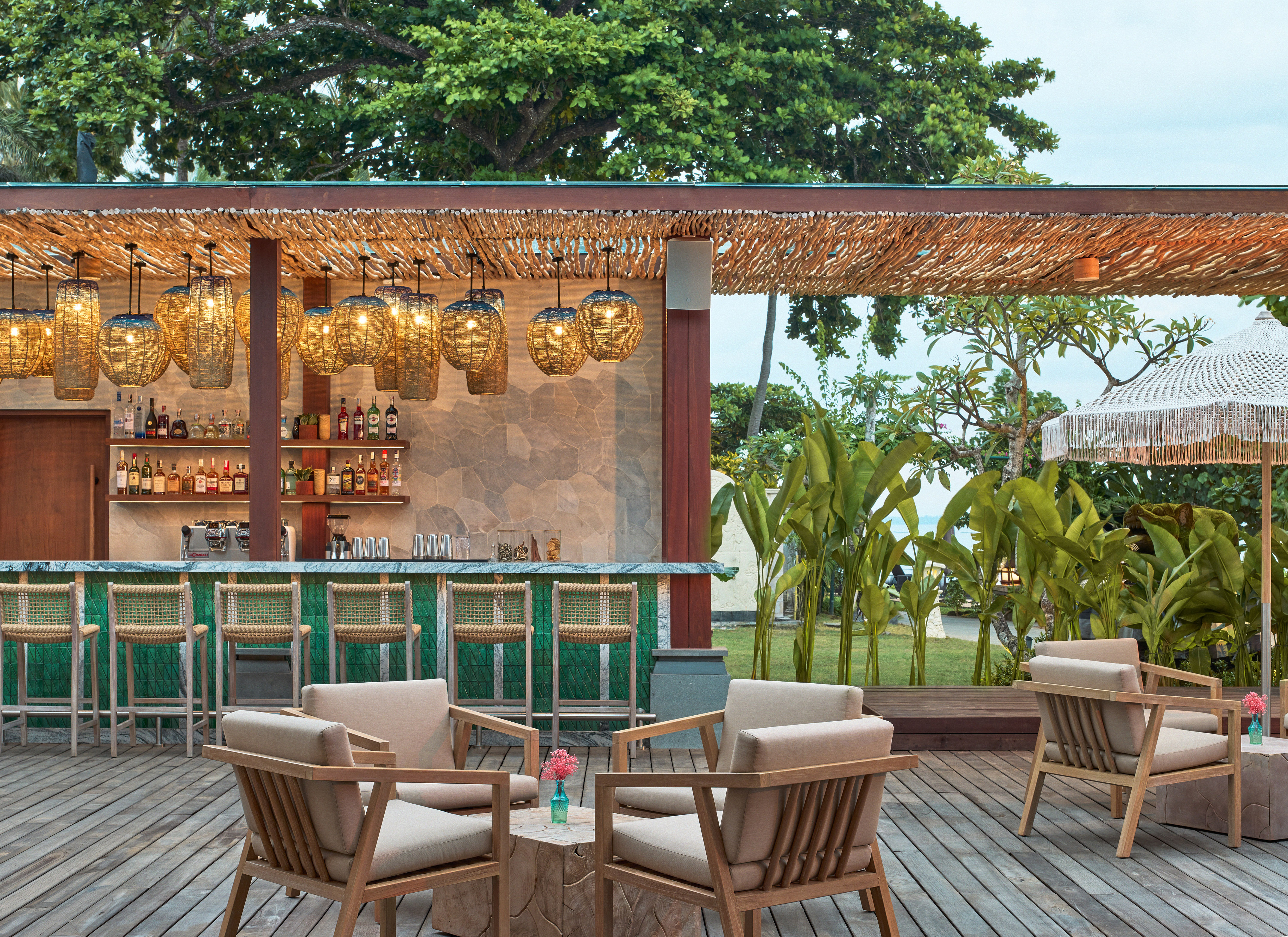 a patio with chairs and a bar