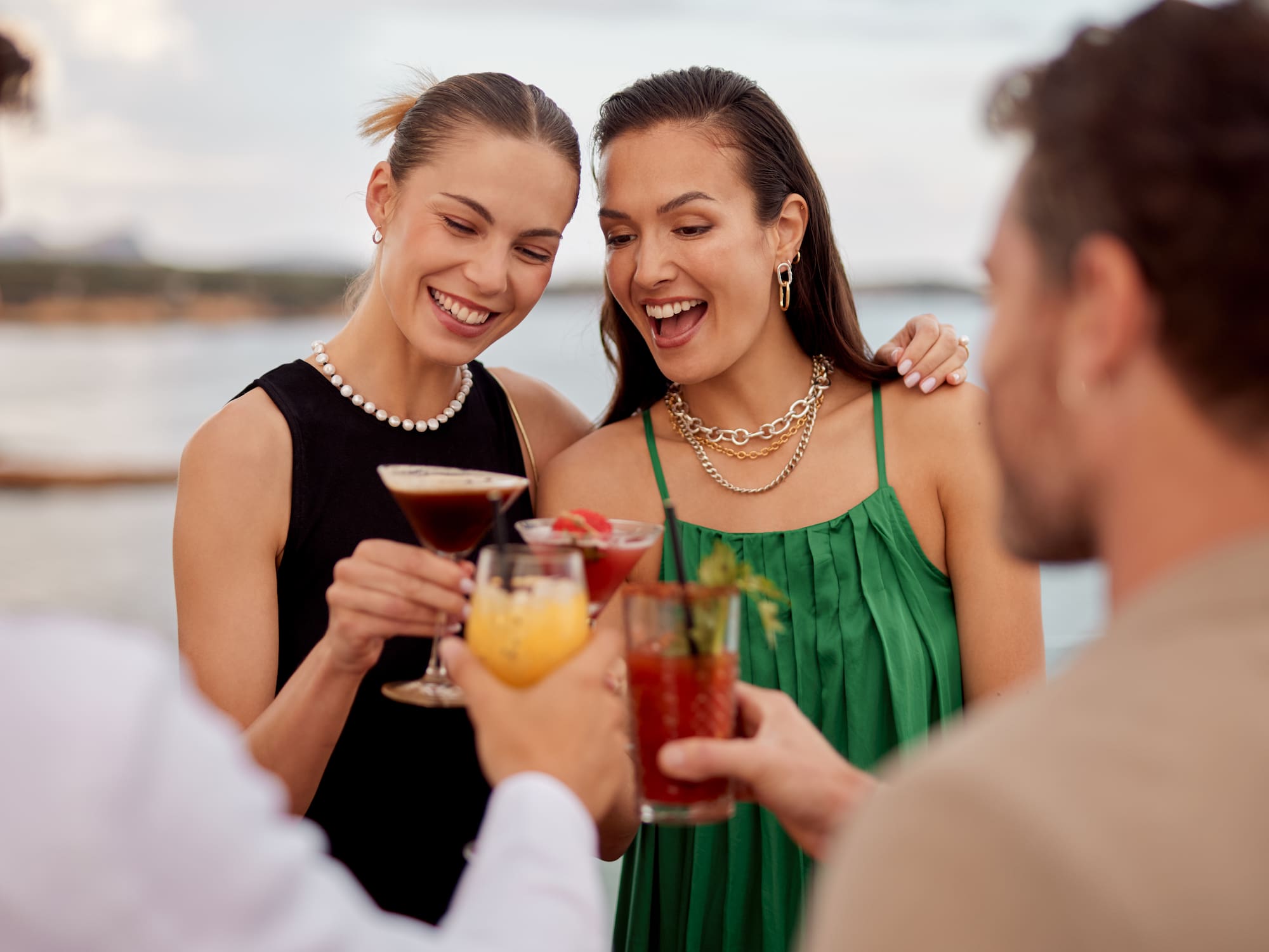 a group of people holding drinks
