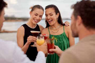 a group of people holding drinks
