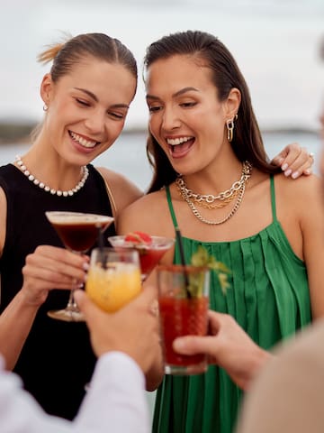 a group of people holding drinks