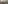 Paris hotel balcony with cityscape, rooftops, table, and golden hour light.